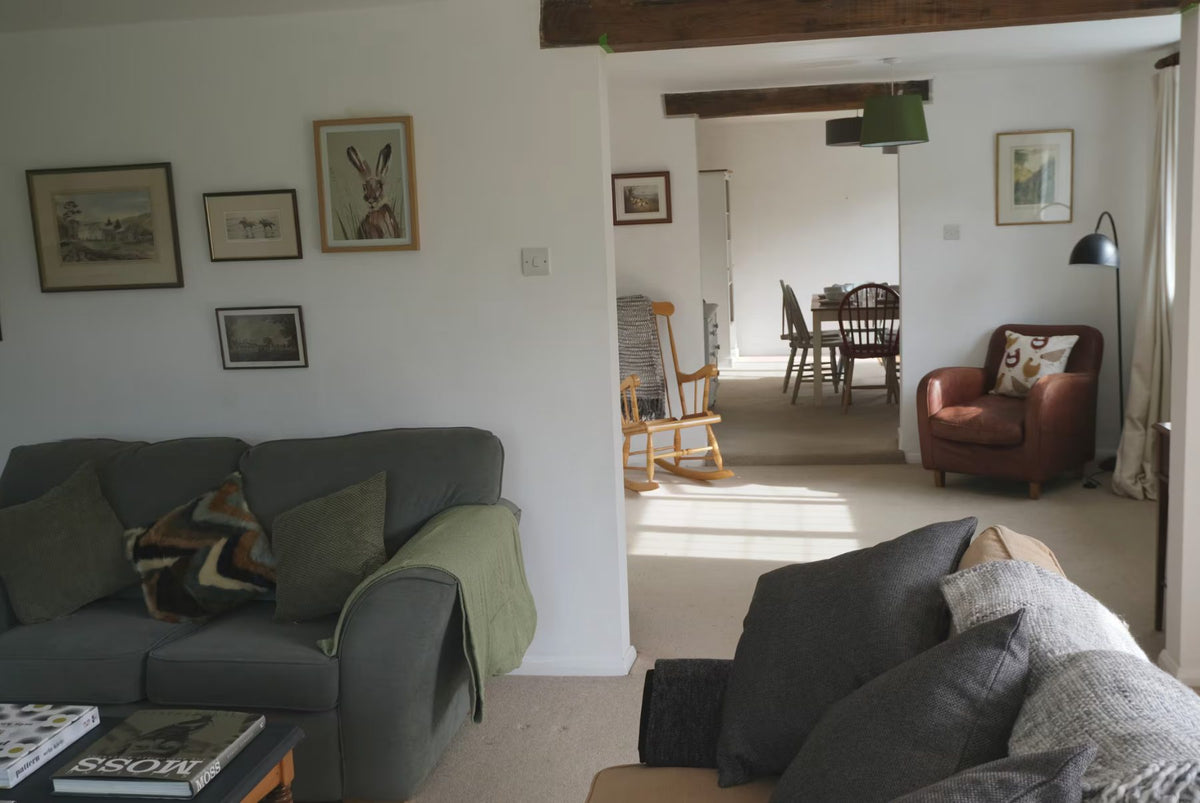 The sitting room at Lower Hawksfold Cottage, opening through to the dining end